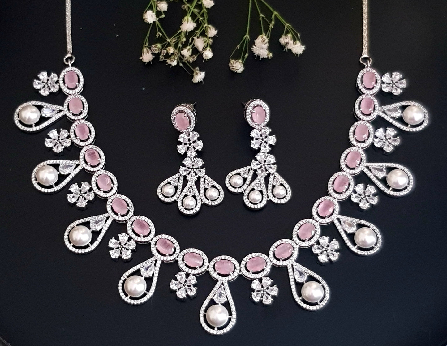 Platinum finish set in pink stone, pearl drops and CZ , matching earrings