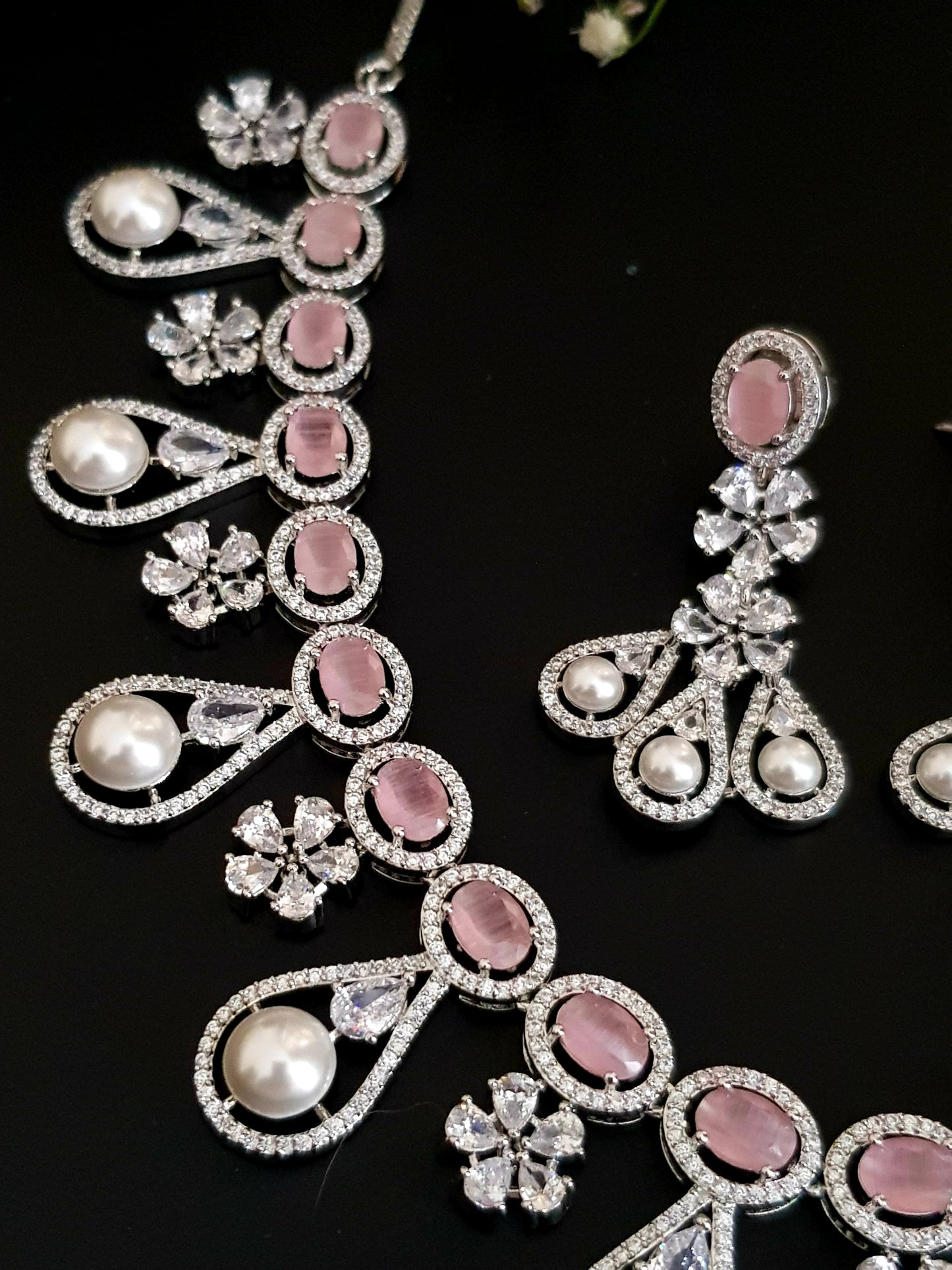 Platinum finish set in pink stone, pearl drops and CZ , matching earrings