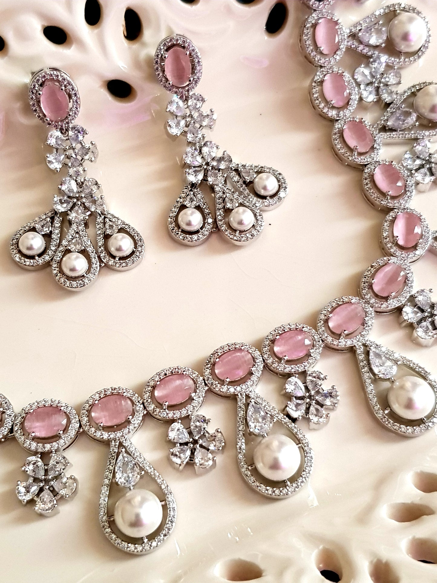 Platinum finish set in pink stone, pearl drops and CZ , matching earrings