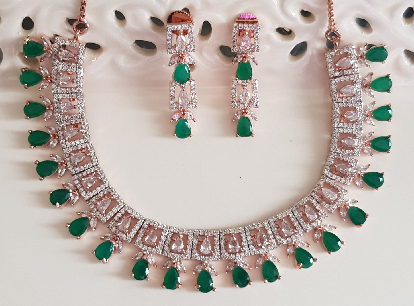 Rose gold finish set, necklace with CZ pieces and emerald drops, matching earrings