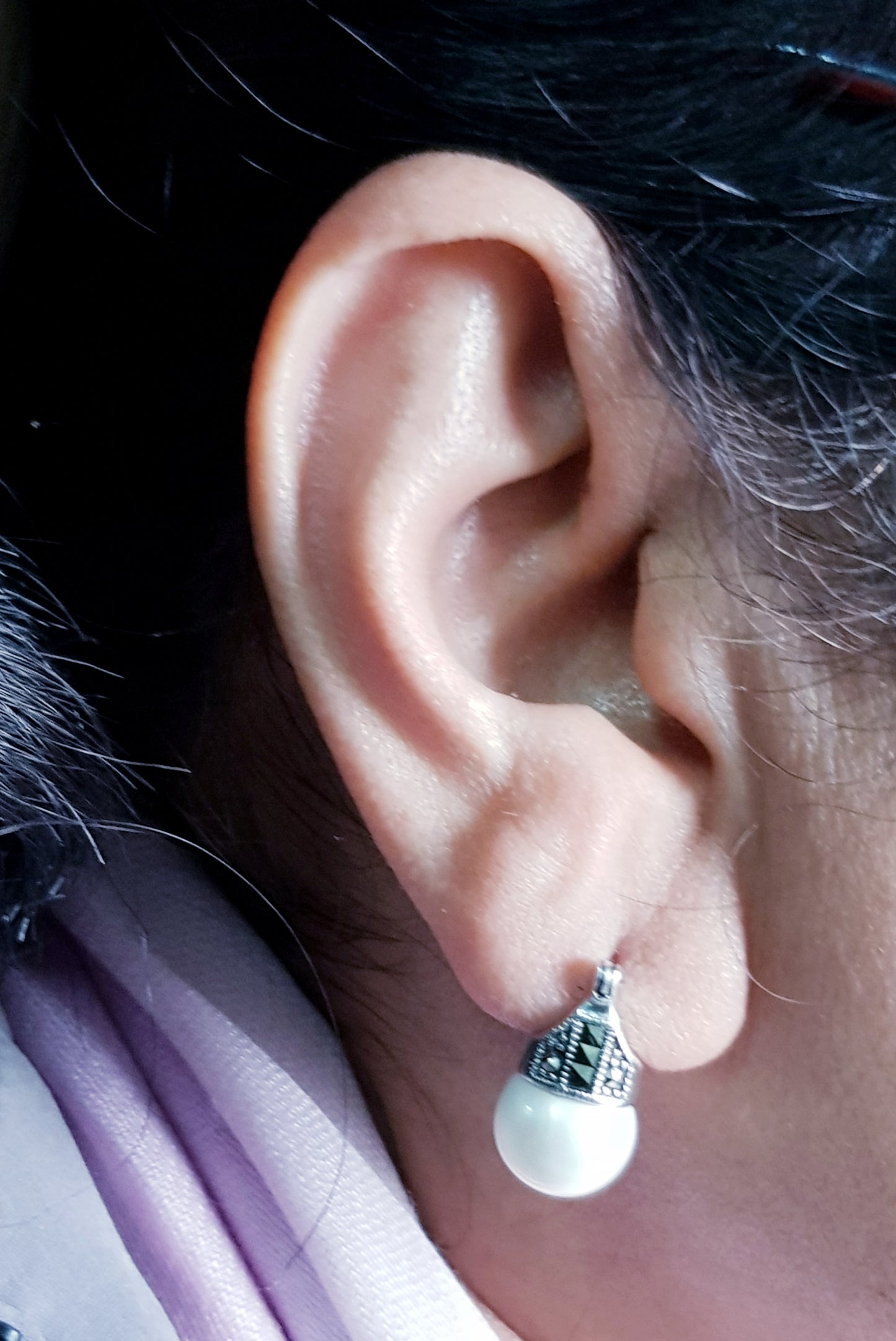 Silver earrings with marcasite and pearl at bottom