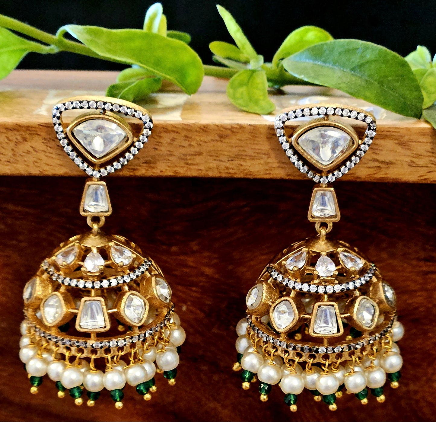 Antique gold finish kundan jhumka (earrings) with CZ and pearl hangings at the bottom of dome, kundan stud