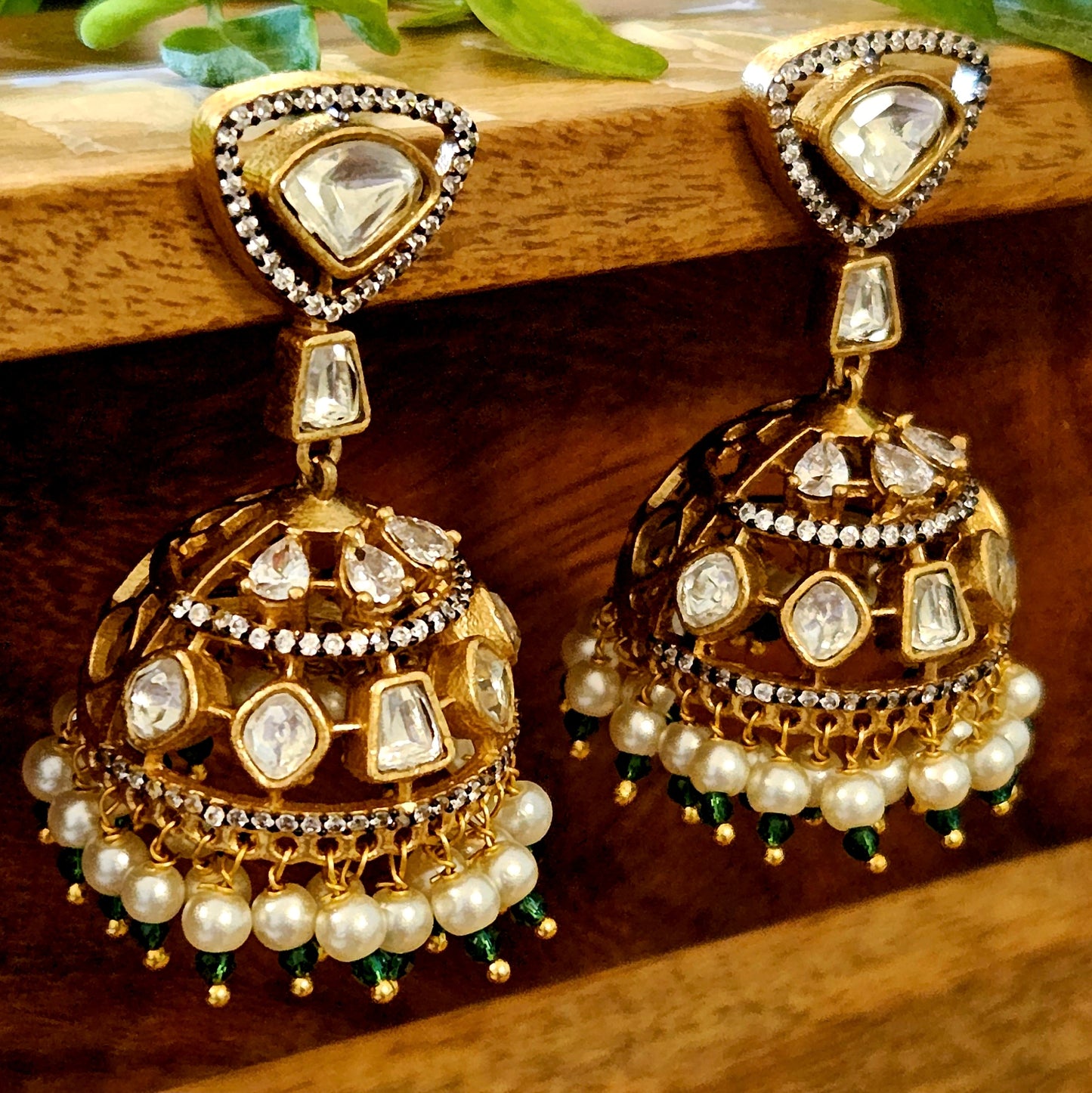 Antique gold finish kundan jhumka (earrings) with CZ and pearl hangings at the bottom of dome, kundan stud