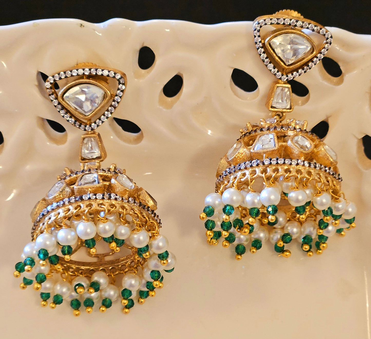 Antique gold finish kundan jhumka (earrings) with CZ and pearl hangings at the bottom of dome, kundan stud