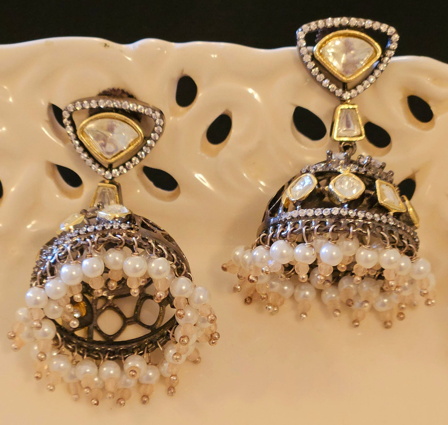 Antique gold finish kundan jhumka (earrings) with CZ and pearl hangings at the bottom of dome, kundan stud