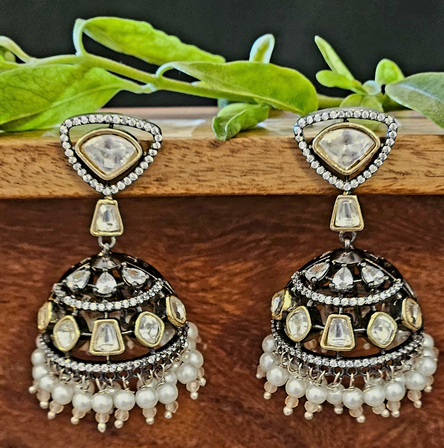 Antique gold finish kundan jhumka (earrings) with CZ and pearl hangings at the bottom of dome, kundan stud