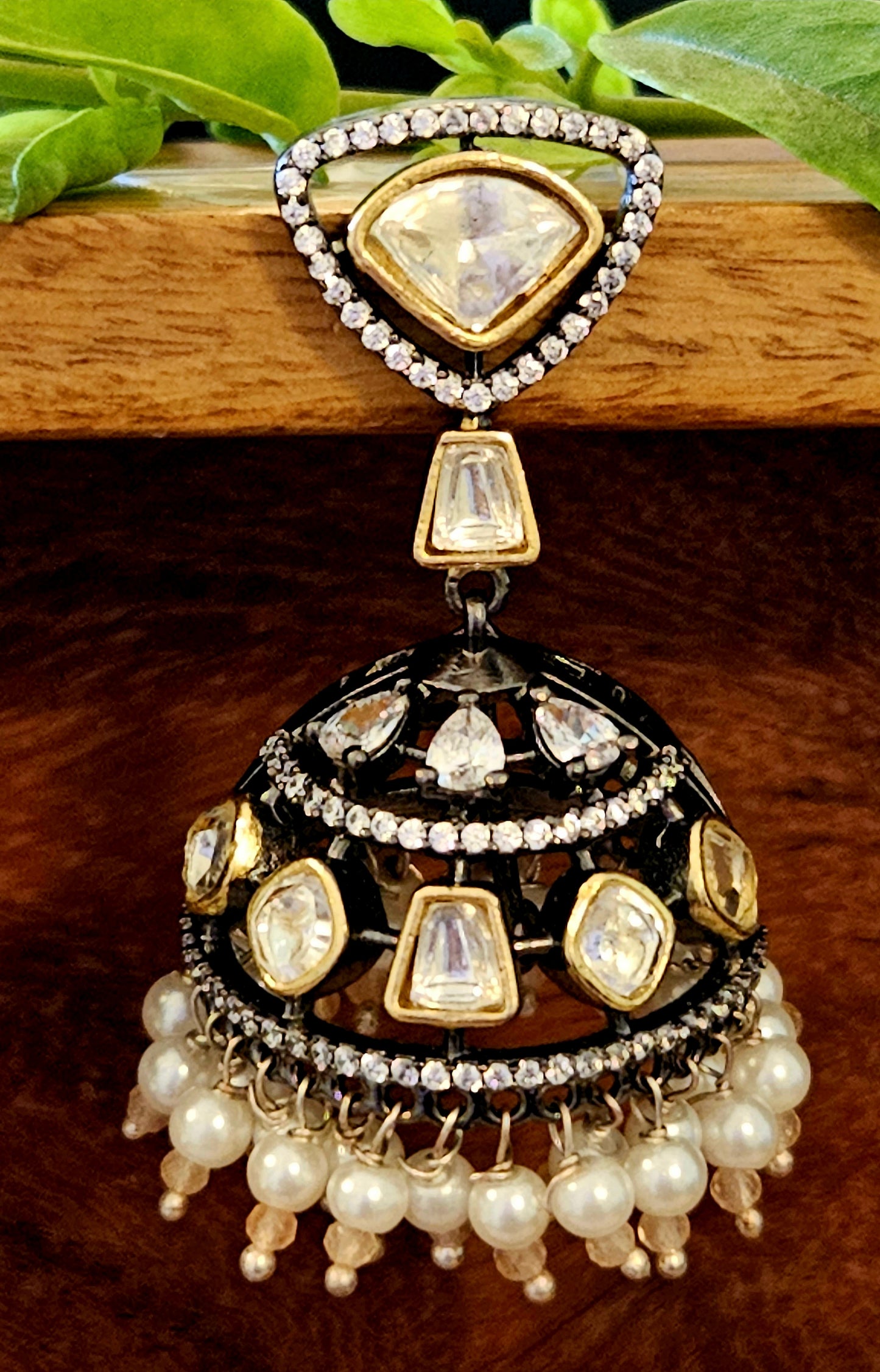 Antique gold finish kundan jhumka (earrings) with CZ and pearl hangings at the bottom of dome, kundan stud