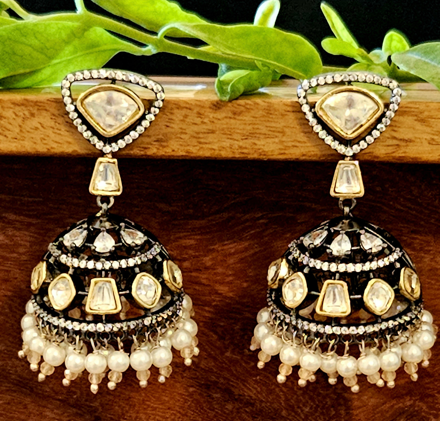 Antique gold finish kundan jhumka (earrings) with CZ and pearl hangings at the bottom of dome, kundan stud