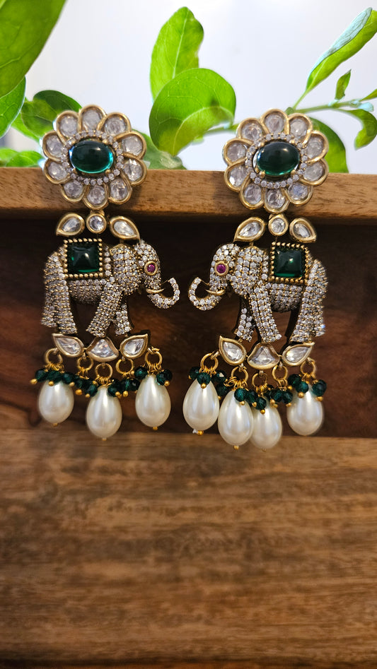 Elephant motif earrings in CZ, kundan, emerald detailing and big pearl hangings