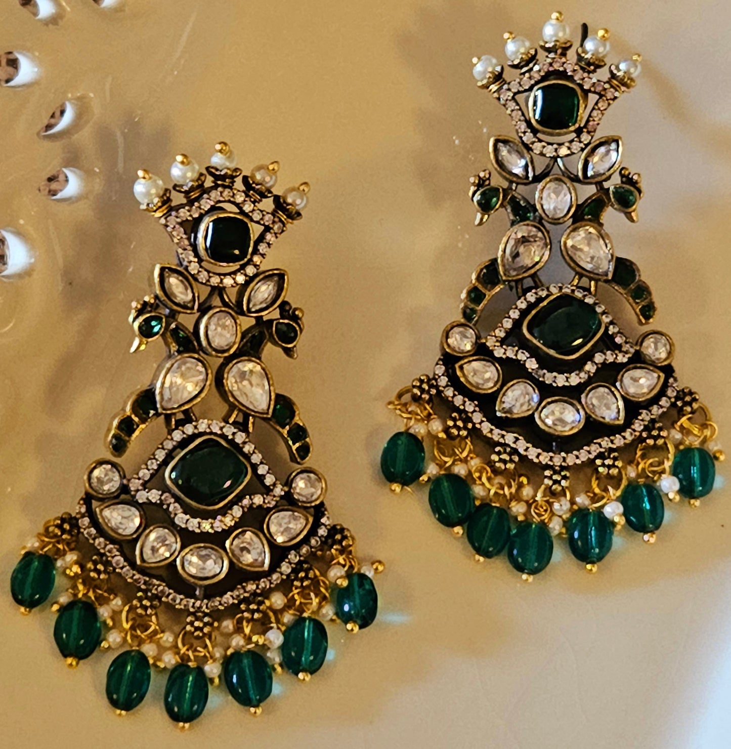 Long antique gold finish victorian earrings,crown stud above pair of peacock, CZ and green stone detailing