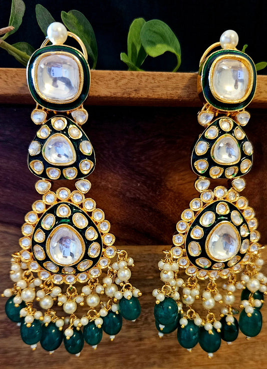 Gold finish long kundan earrings, multiple size kundan stones with green meenakari, finshing with pearl beads and green stones