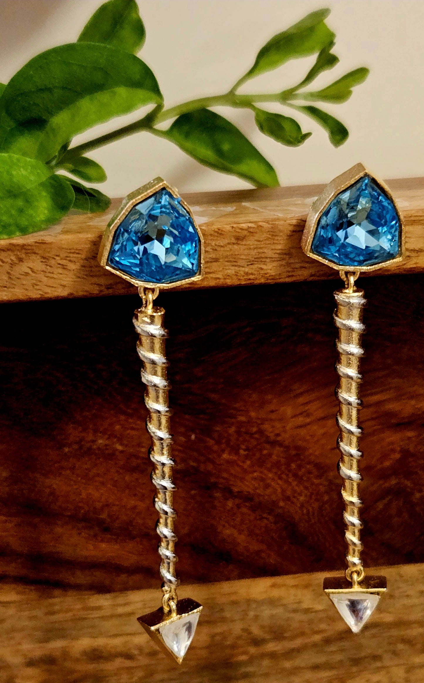 Silver finish long screw design earrings with triangle shaped blue/peach crystal stud and small triangle shaped clear stone at bottom