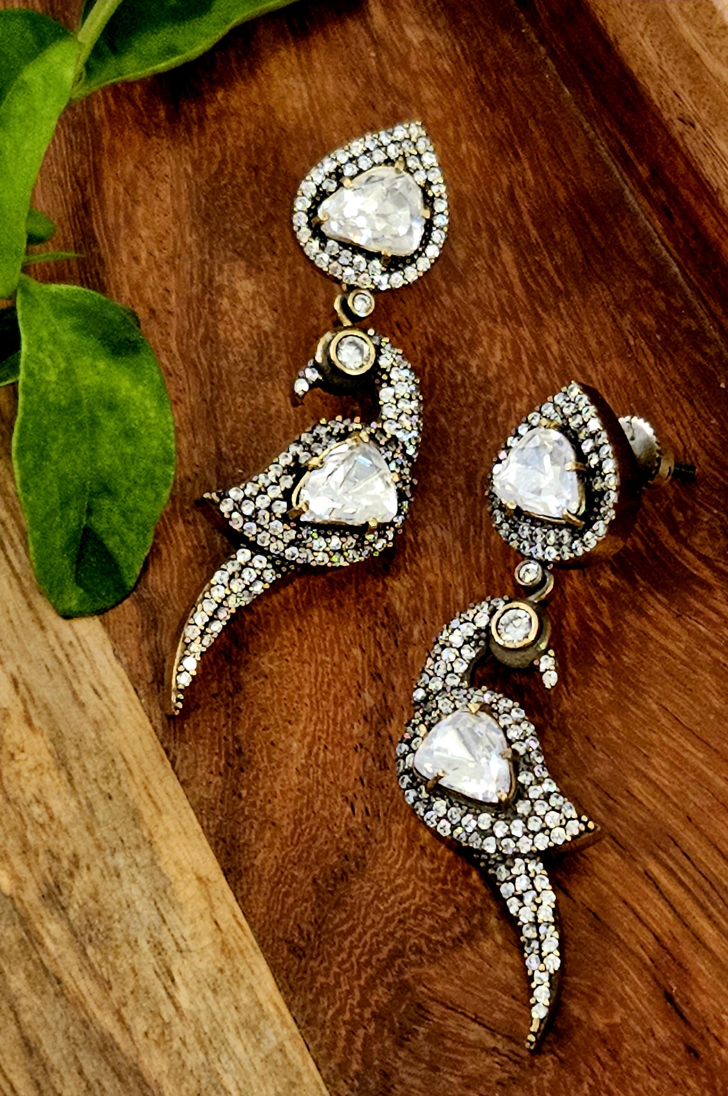 Antique gold finish earrings, parrot design with kundan and CZ detailing