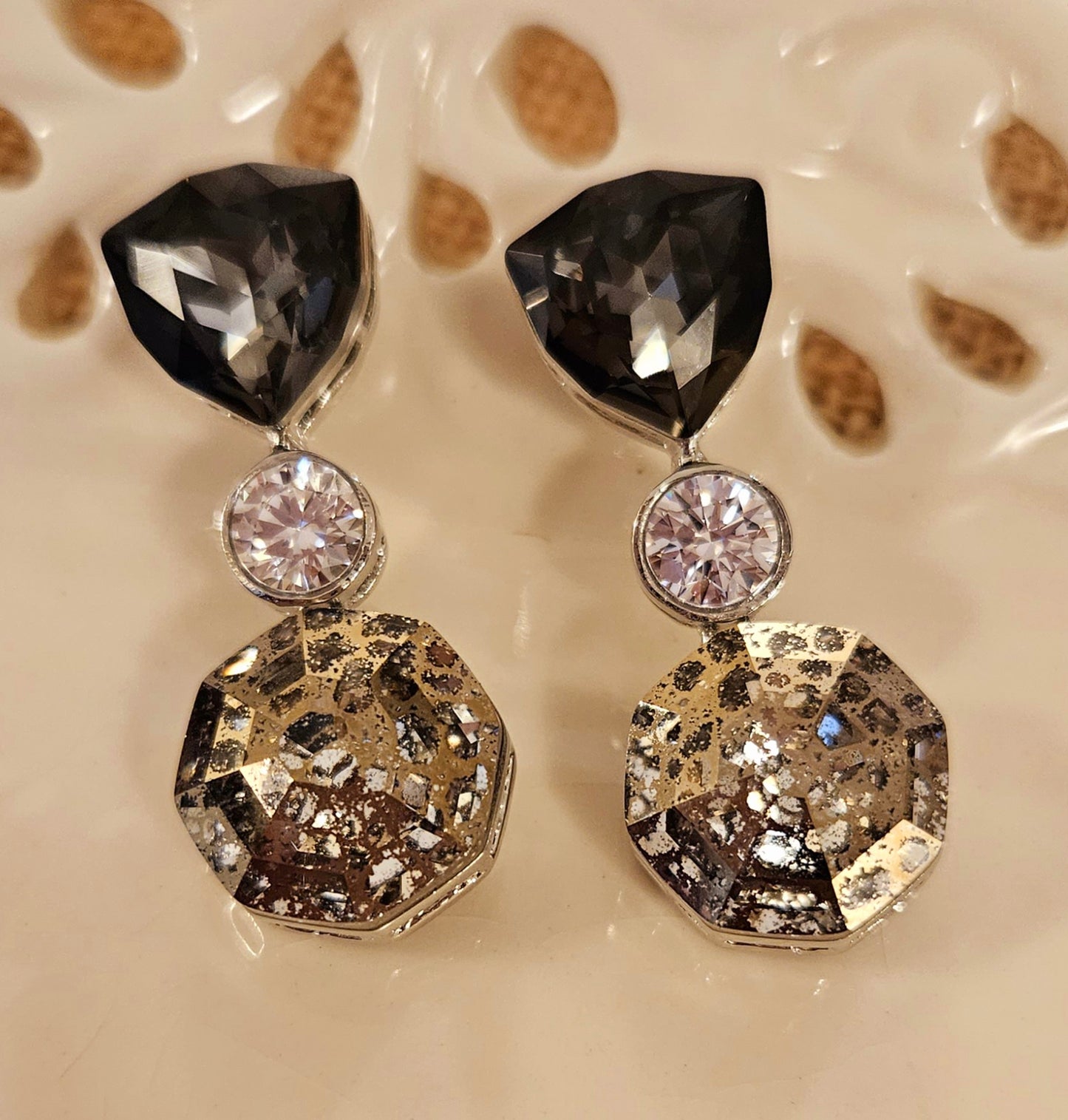 Platinum finish earrings in 3 Swarovski crystals of grey, clear and champagne colour