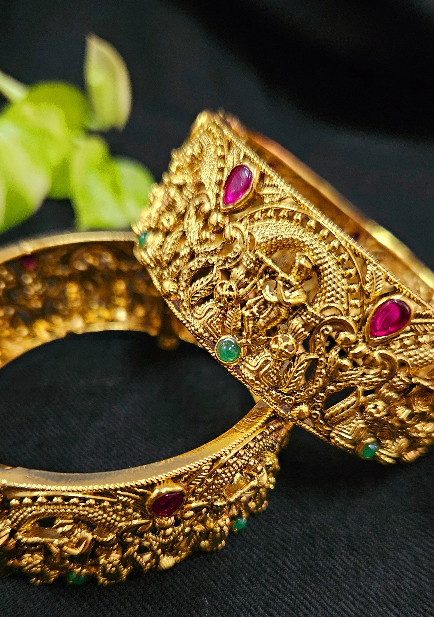 Gold finish temple jewelry kara (bangles) with intricate carving of Krishna playing flute (2 pcs)