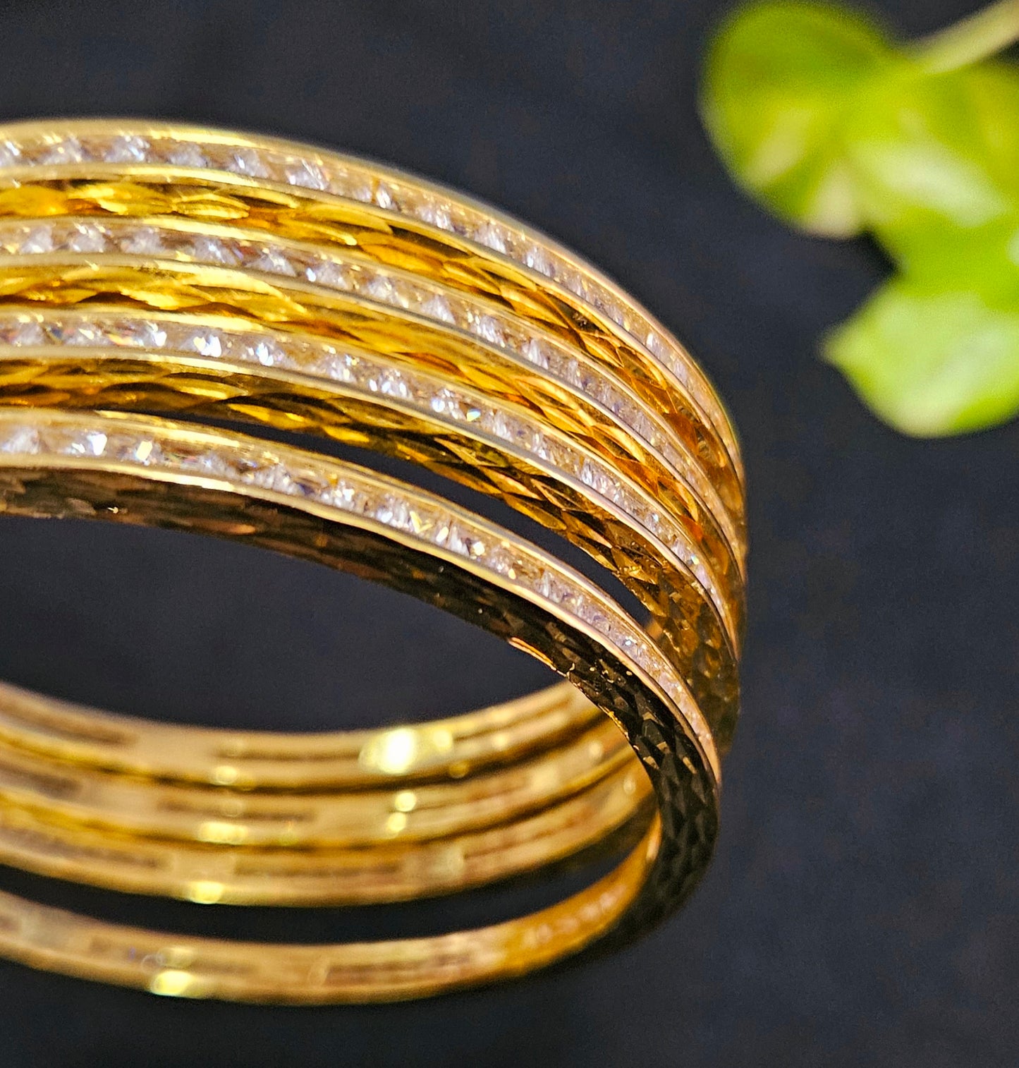 Gold finish sleek bangles with small cylindrical crystal/ruby/emerald/sapphire (4 pcs)