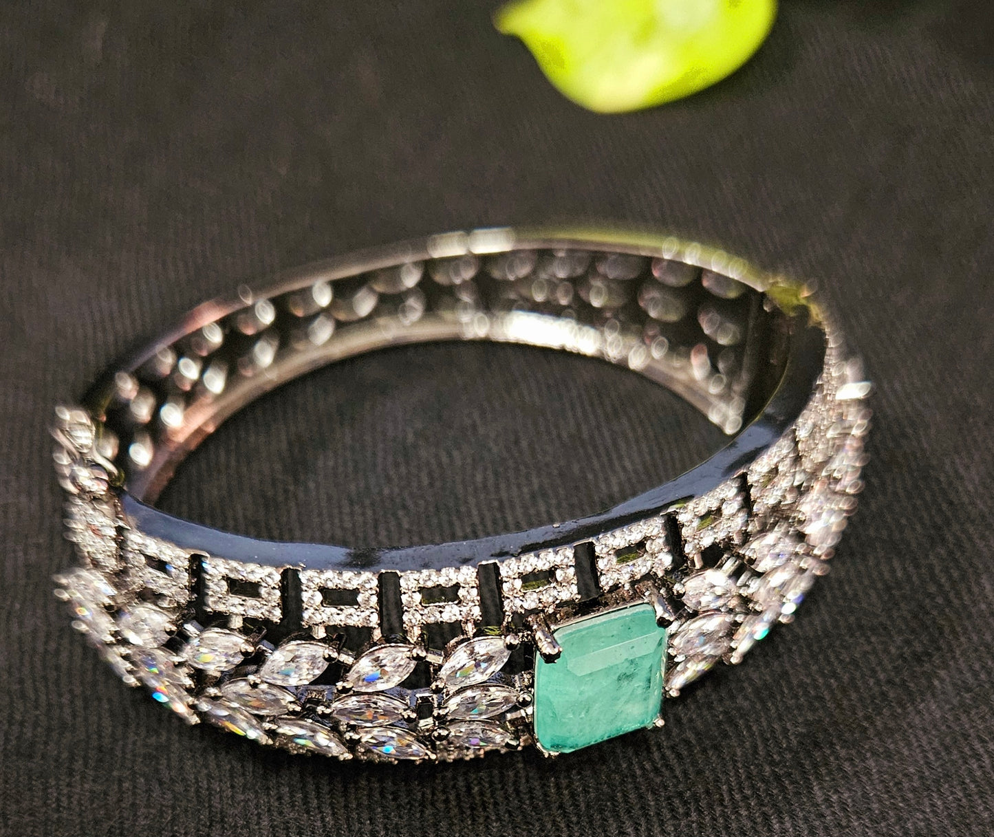 Platinum finish kara (bangle) with leaf shape crystal design and mint green stone (1 pc)