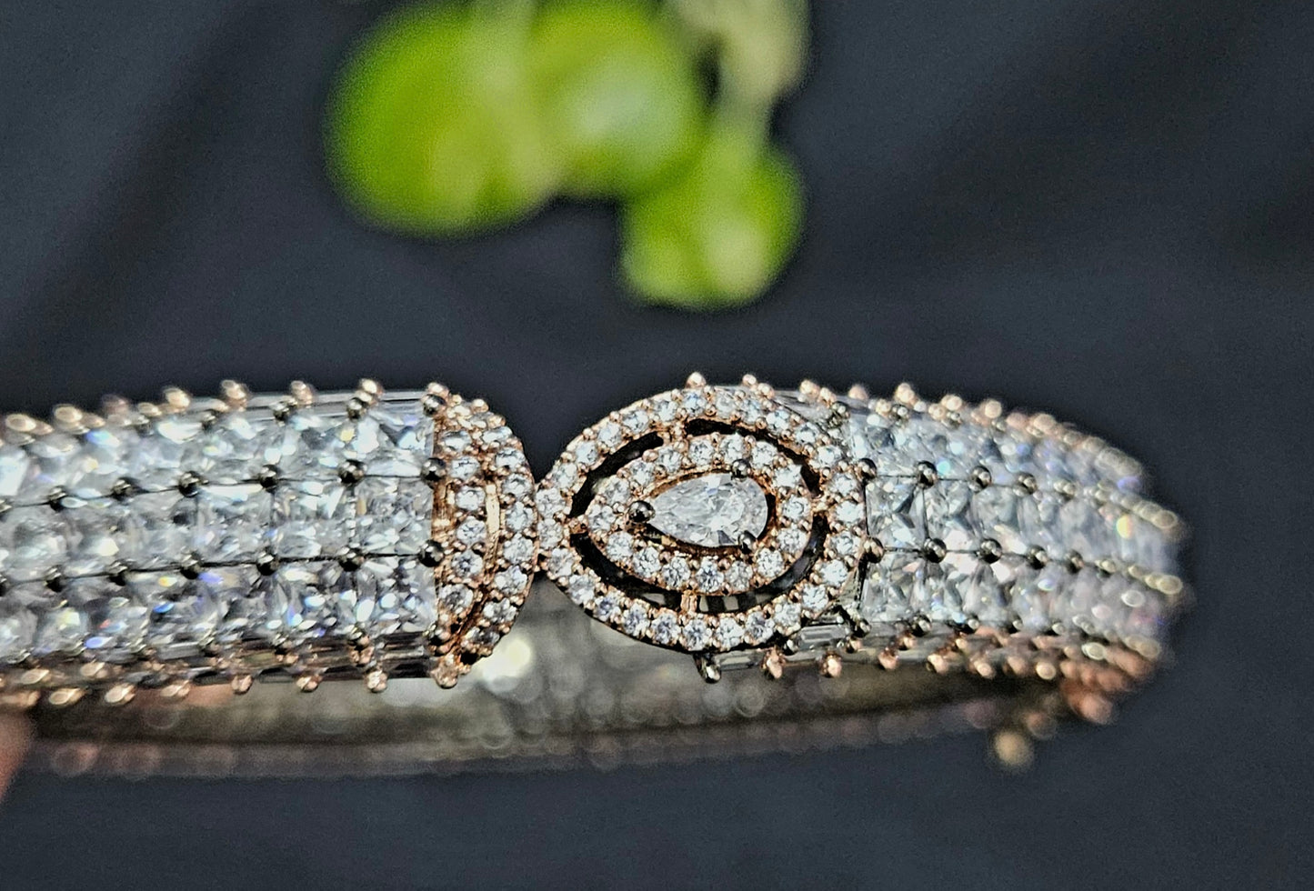 Antique platinum finish kara (bangle) with CZ encrusted all over and one paisley design in centre