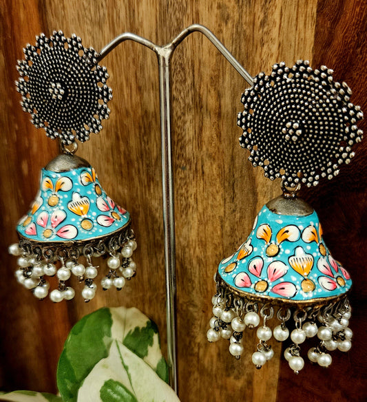 Silver finish jhumka with hand painted dome under a circular stud