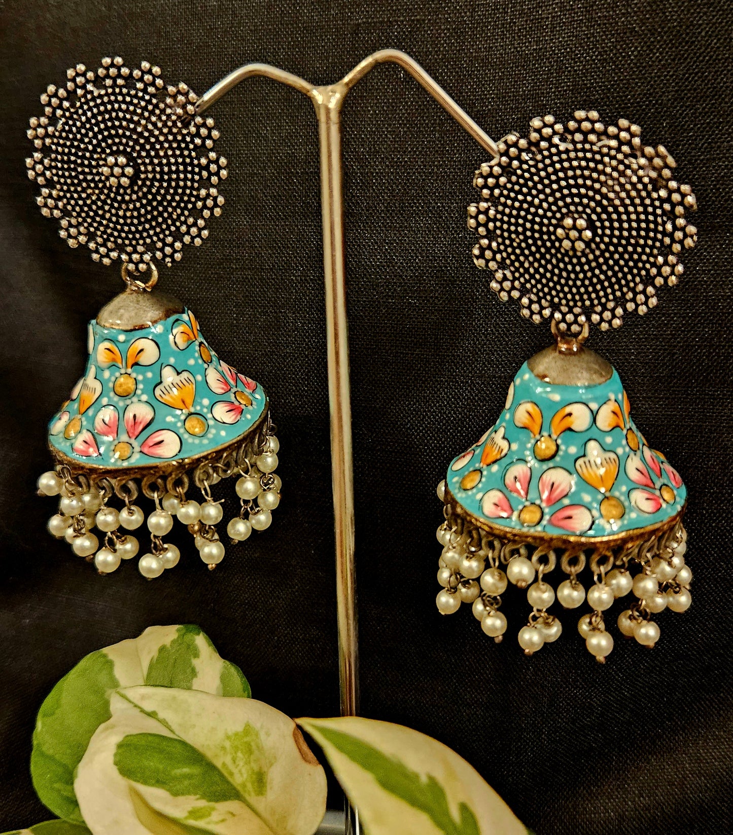 Silver finish jhumka with hand painted dome under a circular stud