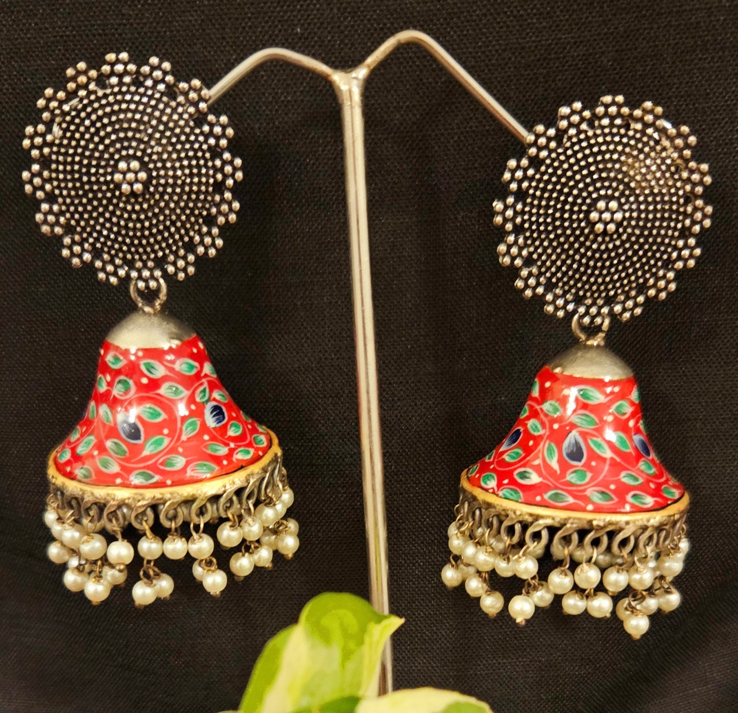 Silver finish jhumka with hand painted dome under a circular stud