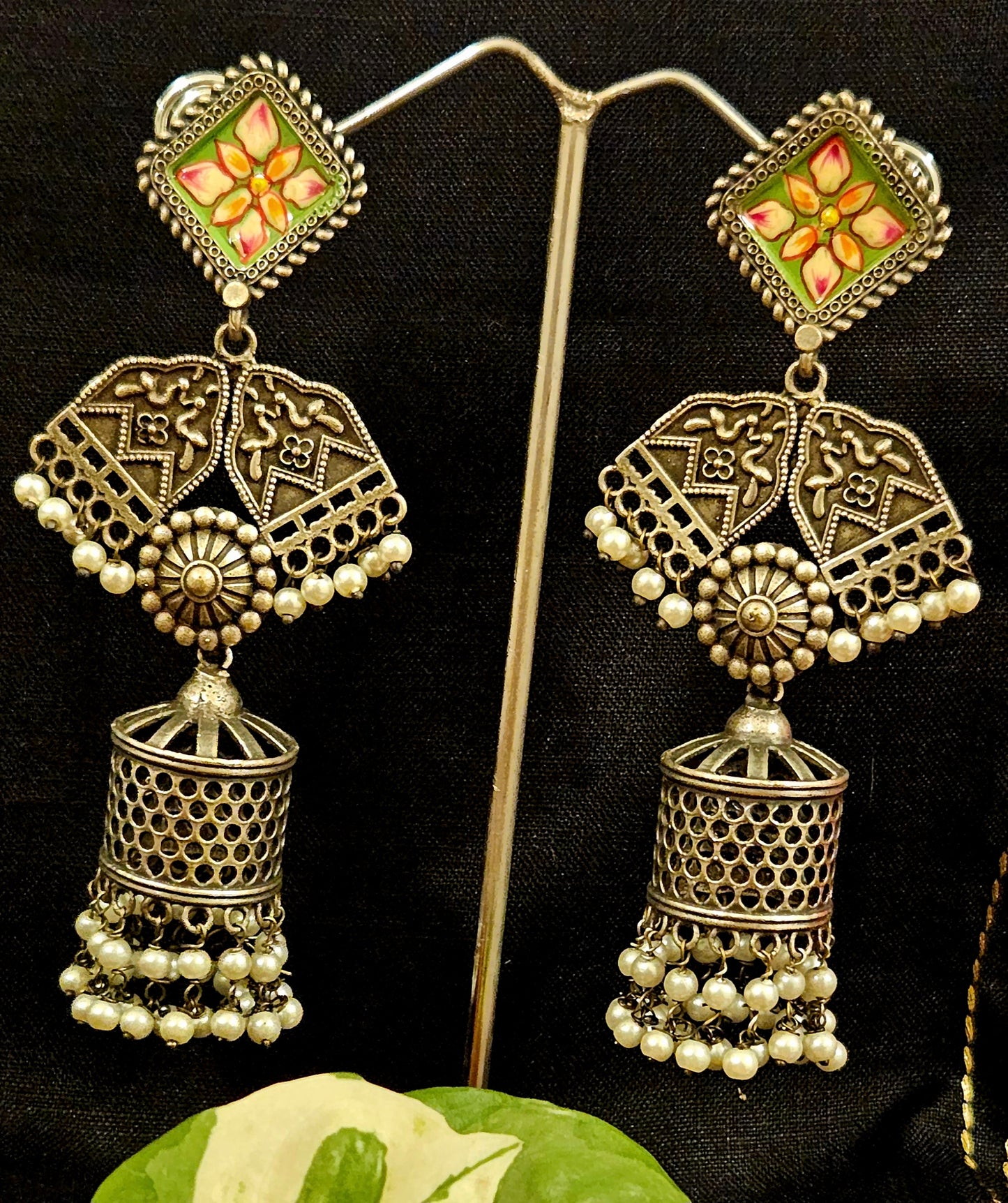 Silver finish jhumka (earrings) with hand painted stud