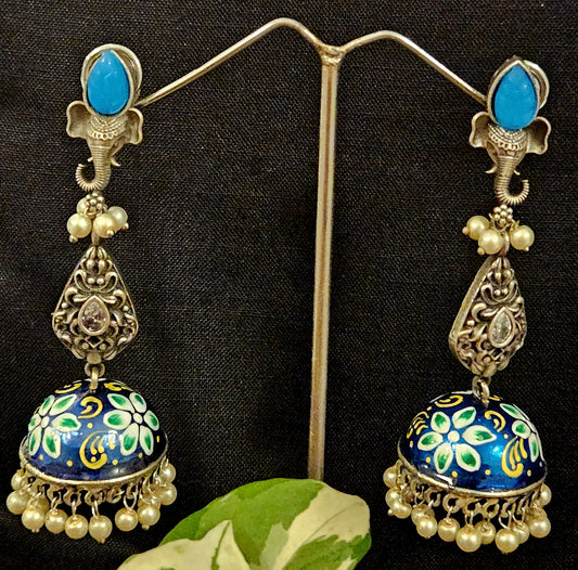 Silver finish jhumka (earrings) with Ganesha head stud and handpainted dome