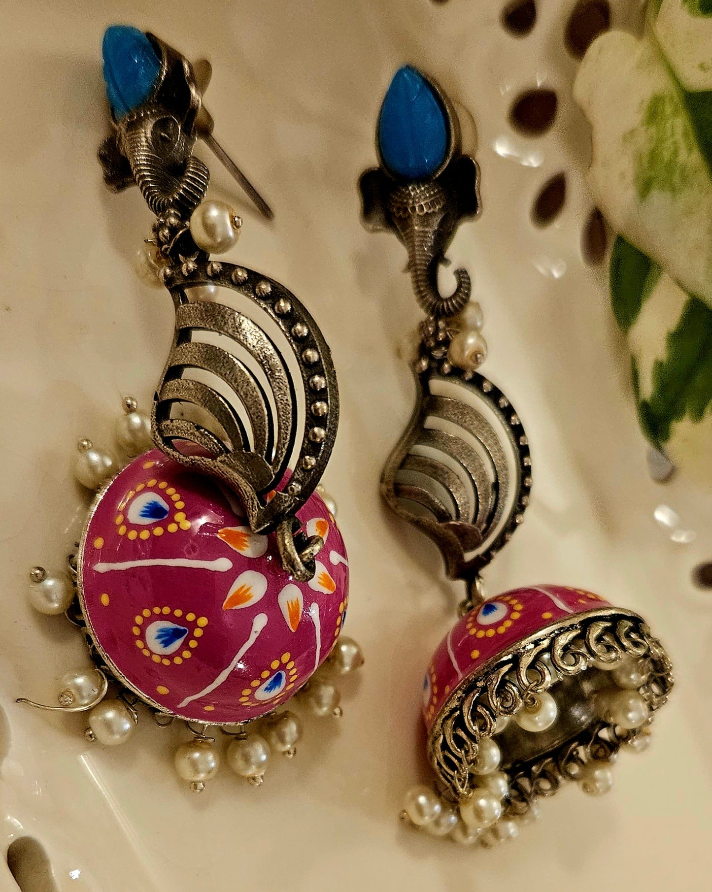 Silver finish jhumka (earrings) with Ganesha head stud and handpainted dome