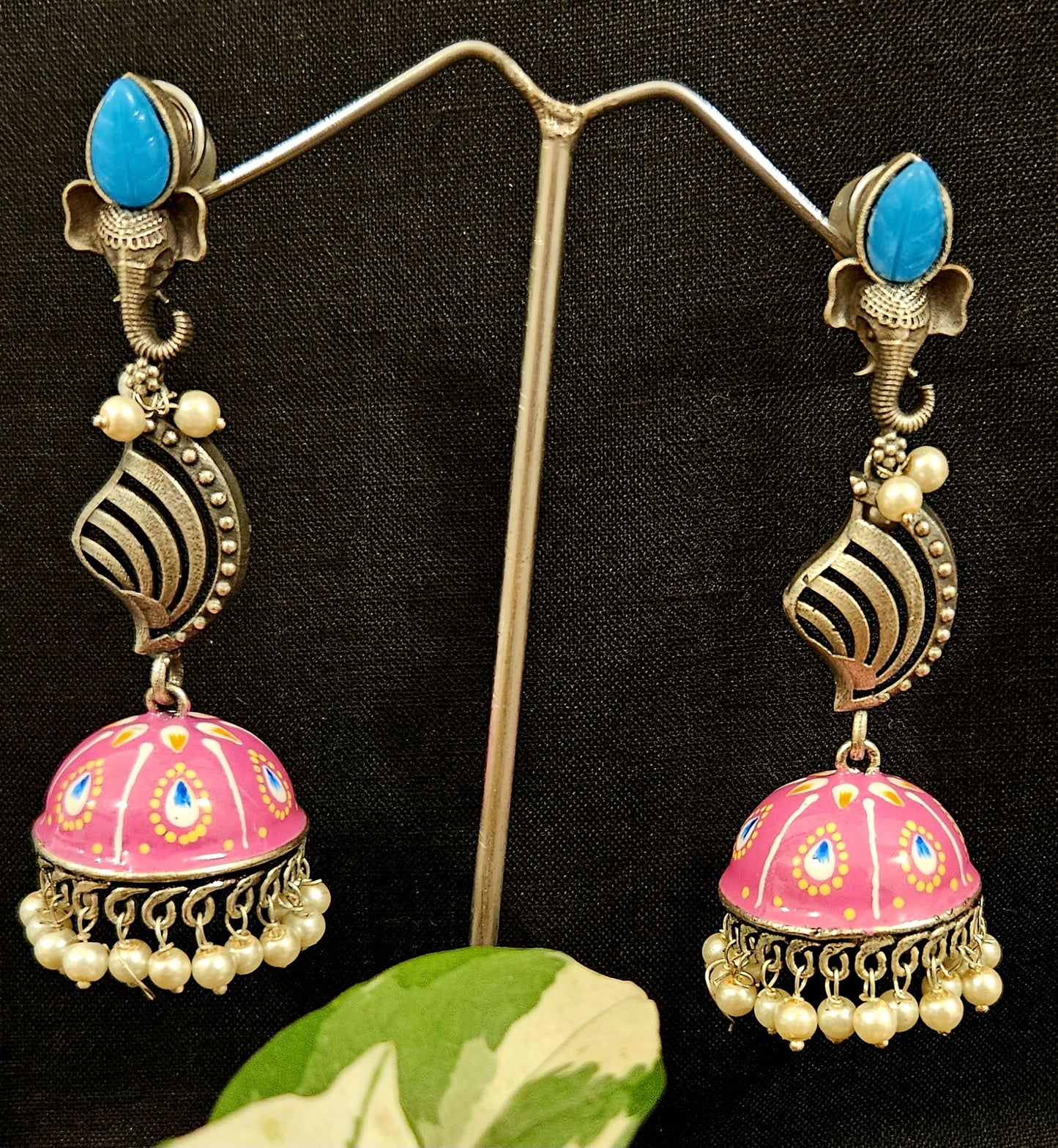 Silver finish jhumka (earrings) with Ganesha head stud and handpainted dome