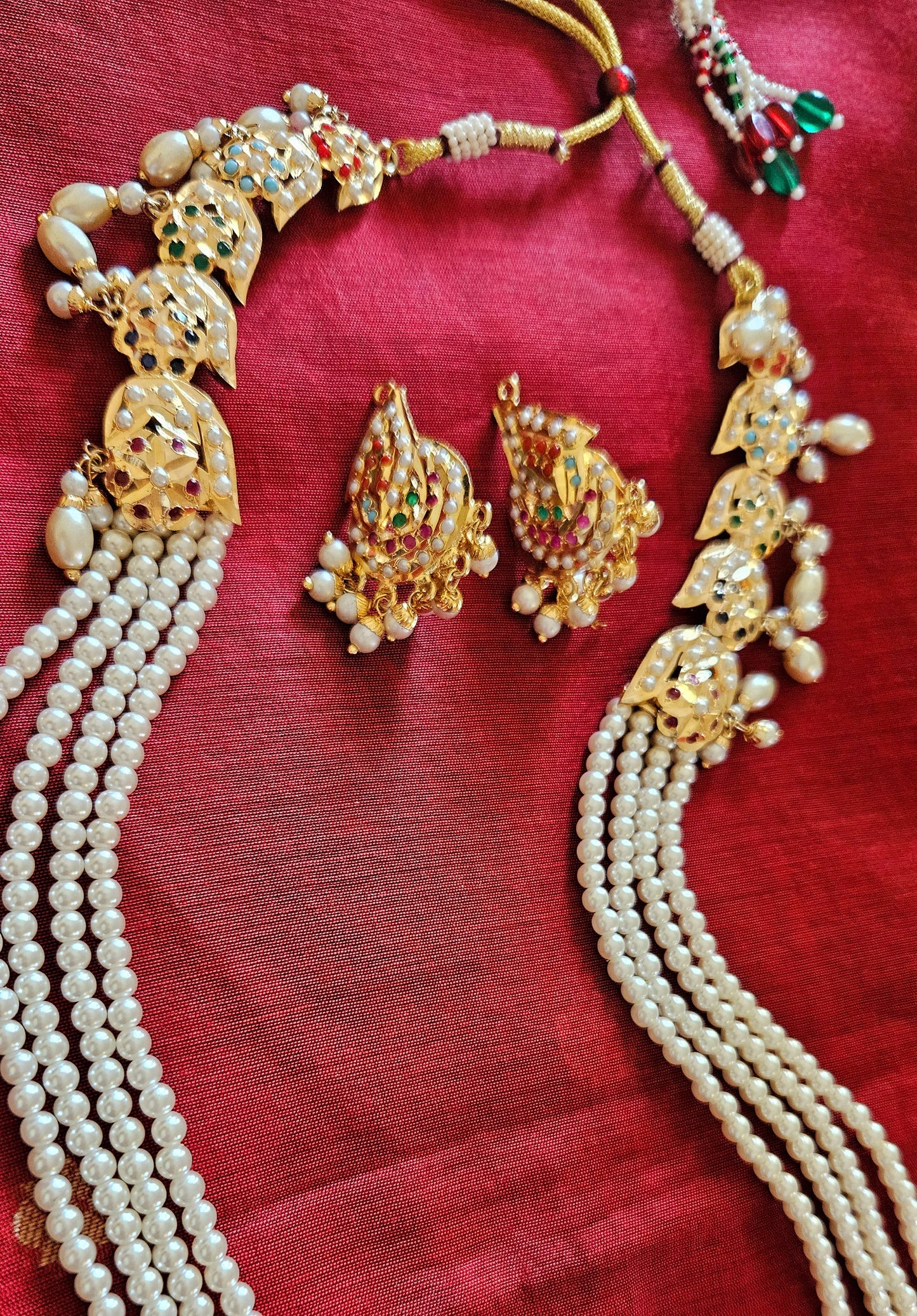 Gold finish jadau set with navratan inlay long pearl necklace, matching studs