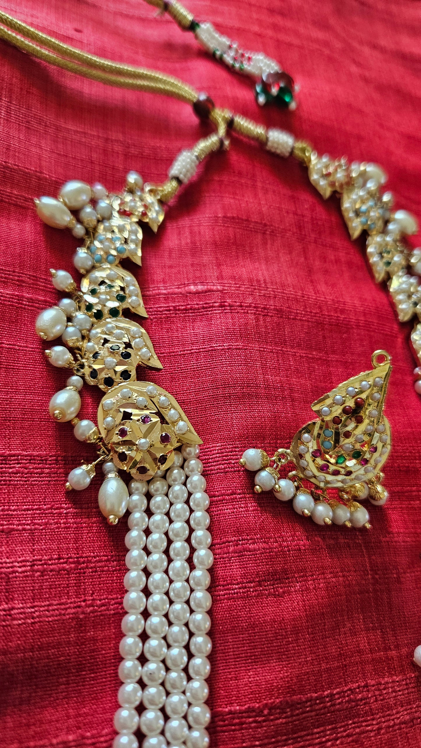 Gold finish jadau set with navratan inlay long pearl necklace, matching studs