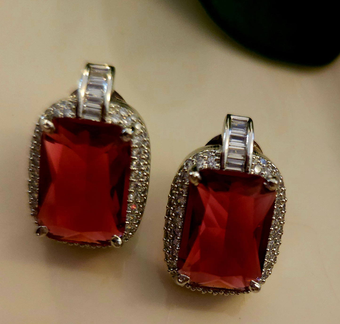 Platinum finish set with ruby pendant in CZ necklace, matching earrings