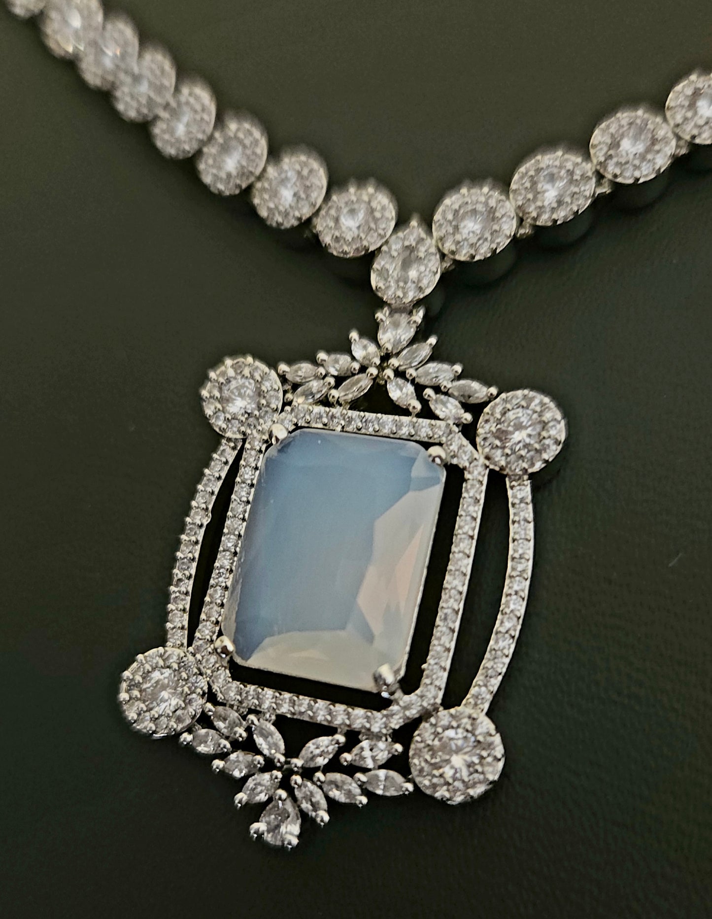 Platinum finish set with Milky white rectangular doublet pendant in CZ frame, matching earrings