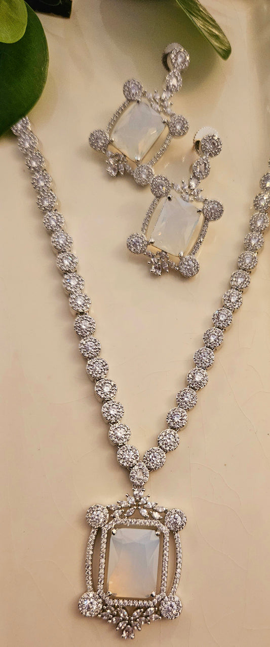 Platinum finish set with Milky white rectangular doublet pendant in CZ frame, matching earrings