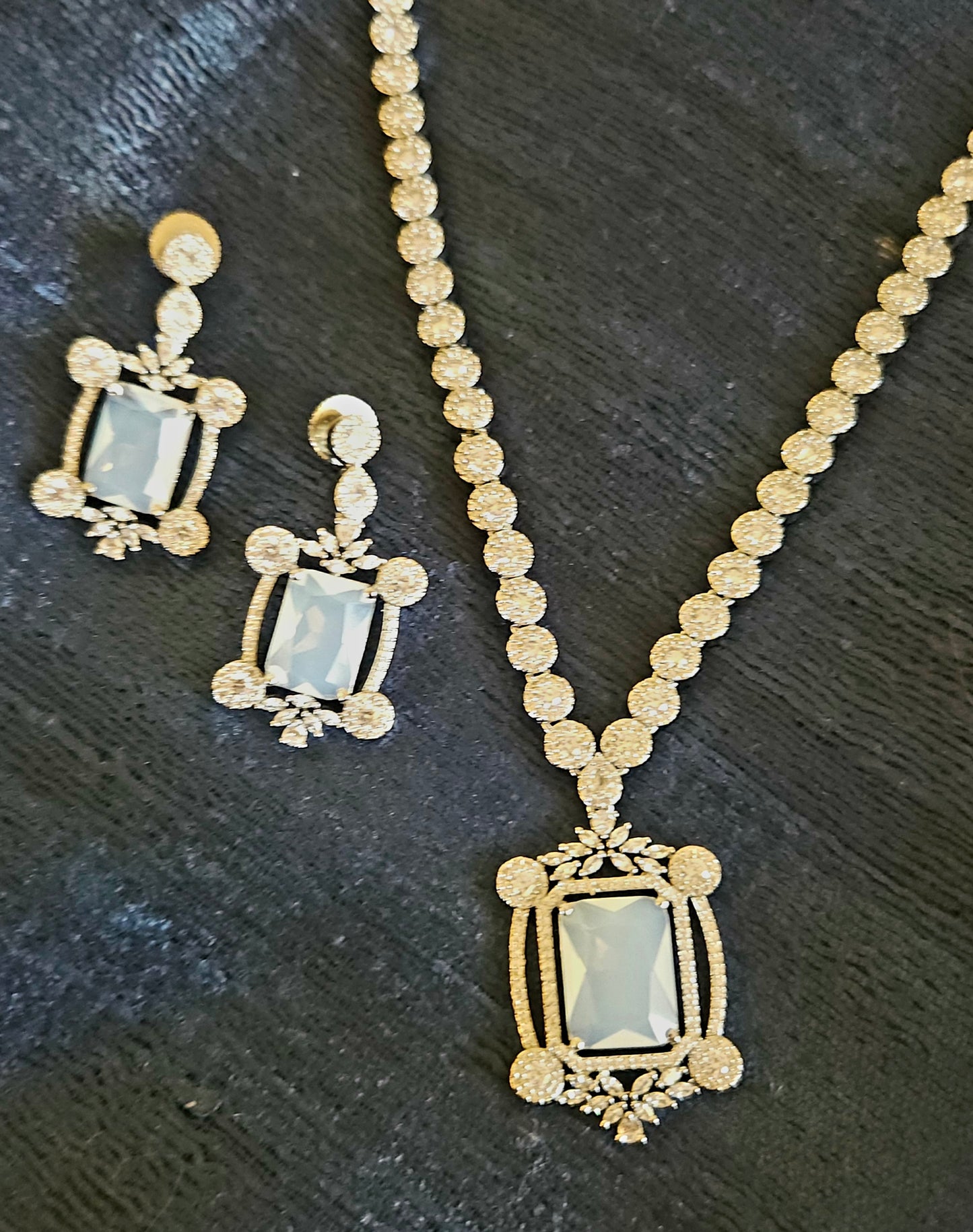 Platinum finish set with Milky white rectangular doublet pendant in CZ frame, matching earrings