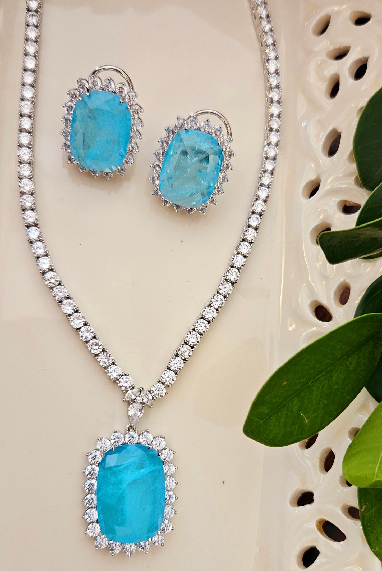 Platinum finish doublet stone pendant set in single strand clear crystal, matching studs (earrings)