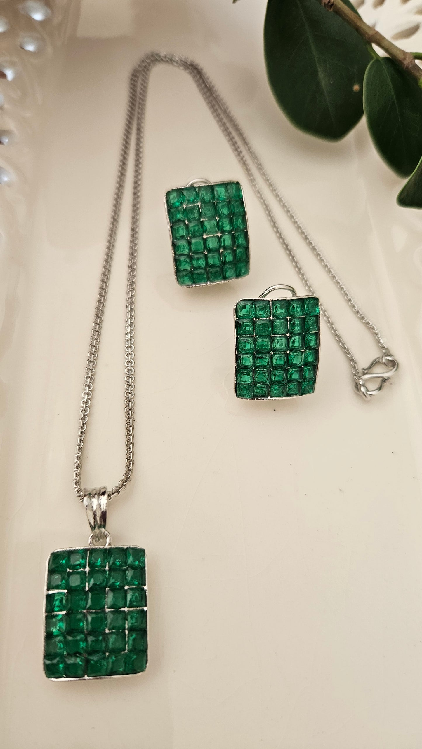 Platinum finish pendant set with green/black/red/blue stone set in rectangle pendant, matching studs (earrings)