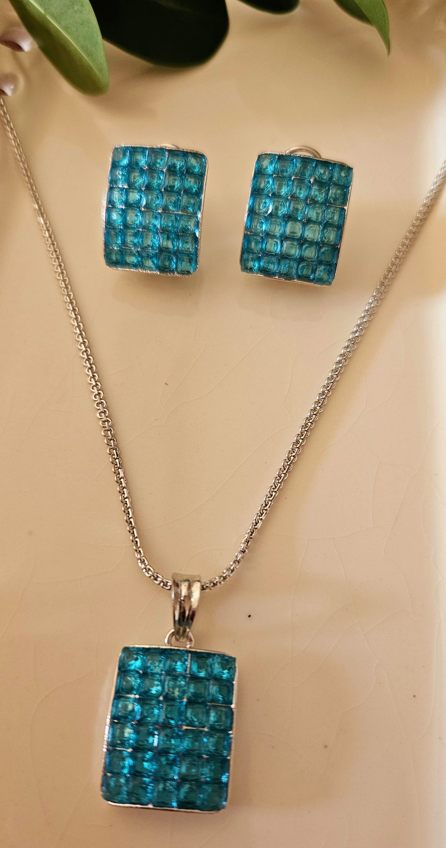 Platinum finish pendant set with green/black/red/blue stone set in rectangle pendant, matching studs (earrings)