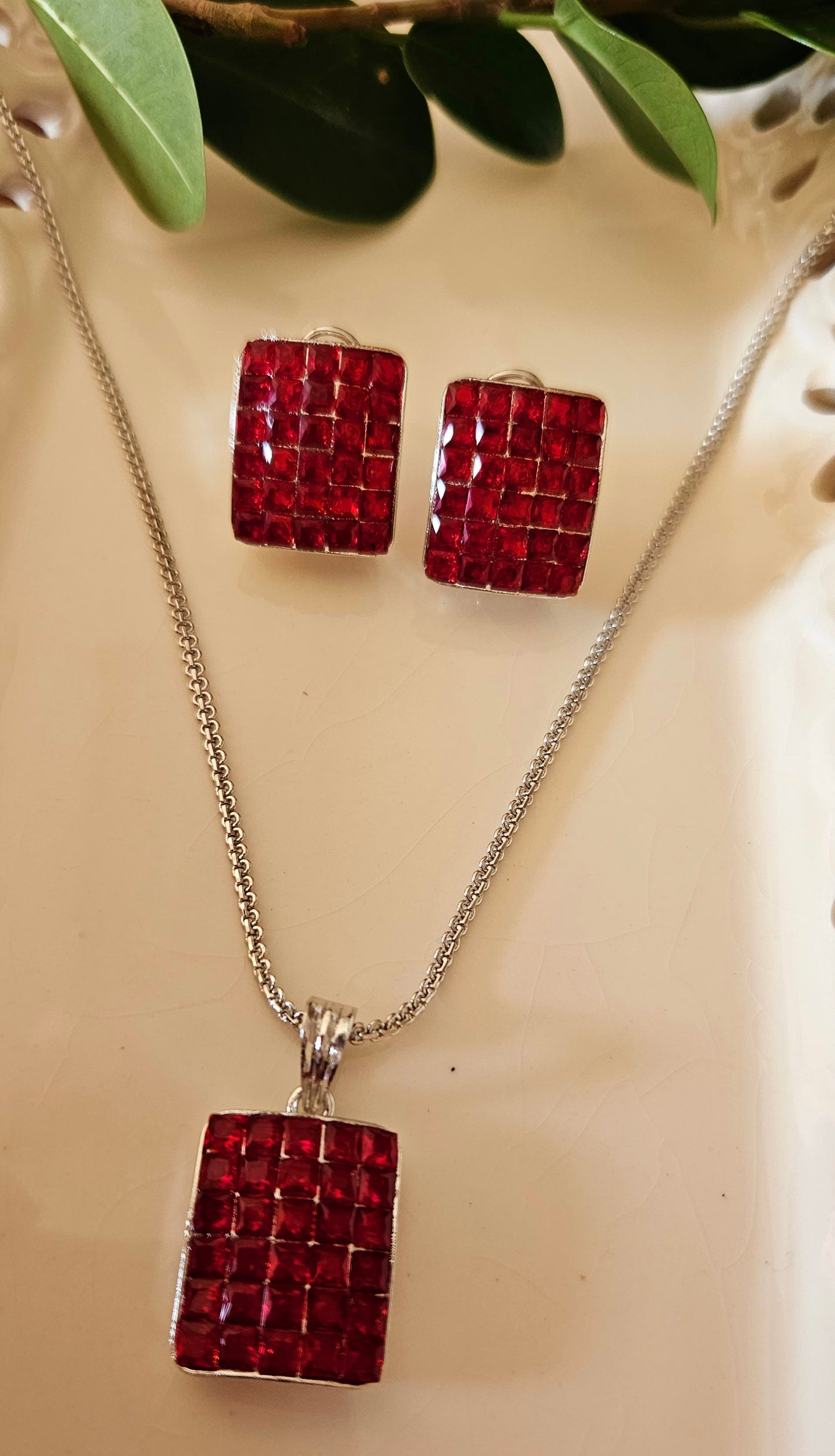 Platinum finish pendant set with green/black/red/blue stone set in rectangle pendant, matching studs (earrings)