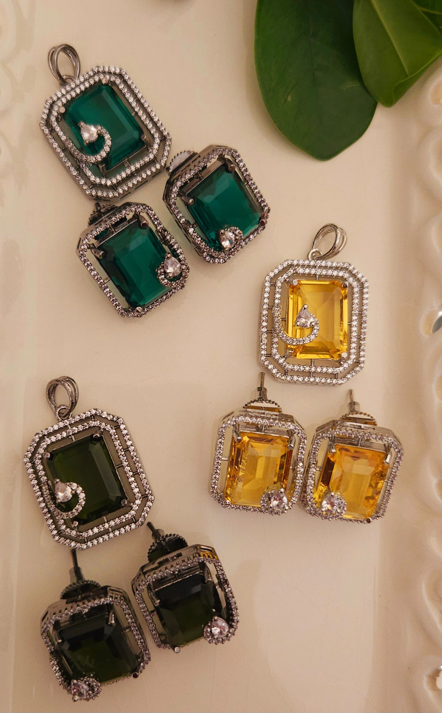 Platinum finish pendant set in topaz/green/moss green stone accentuated with CZ, matching studs (earrings)