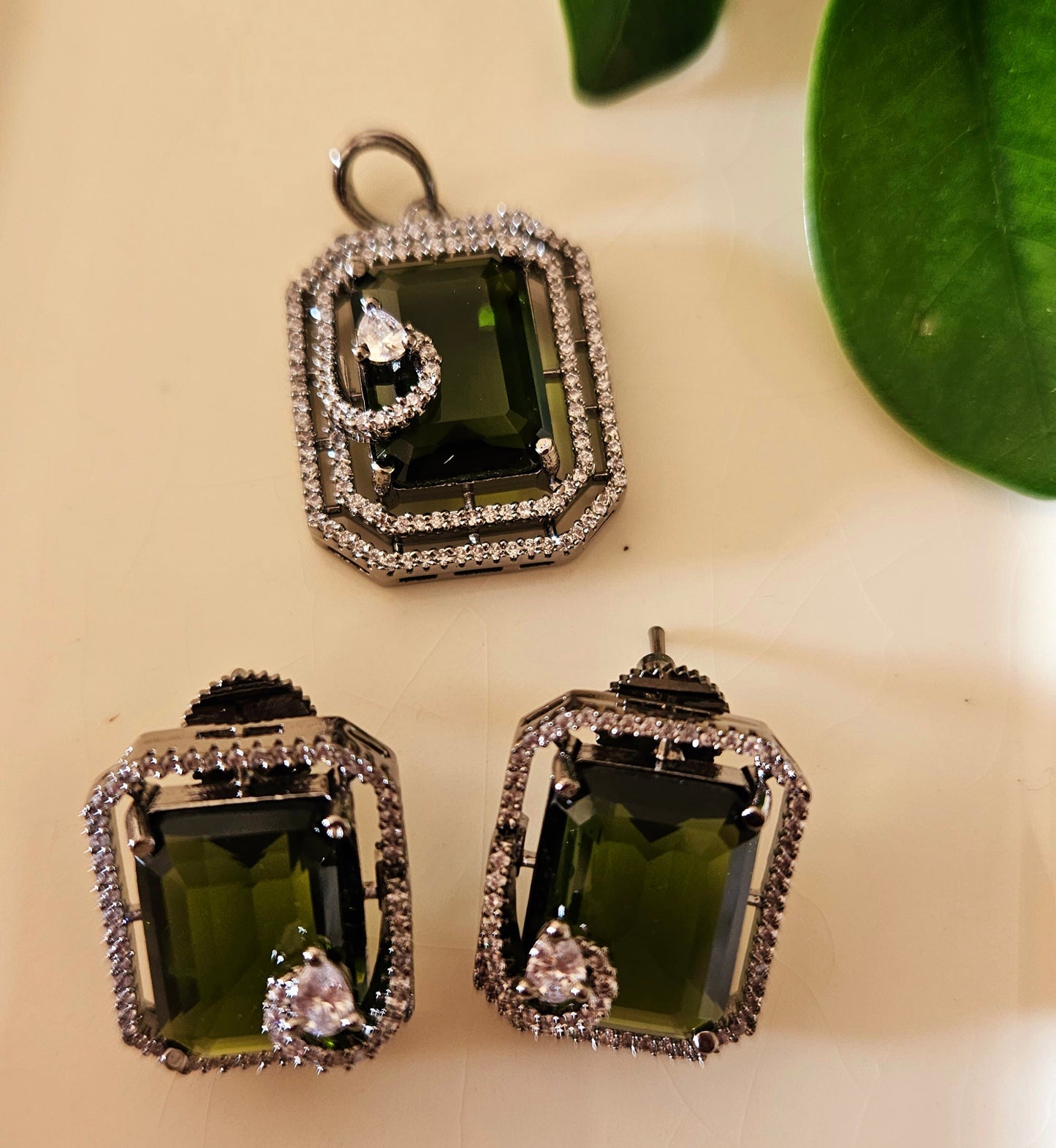 Platinum finish pendant set in topaz/green/moss green stone accentuated with CZ, matching studs (earrings)