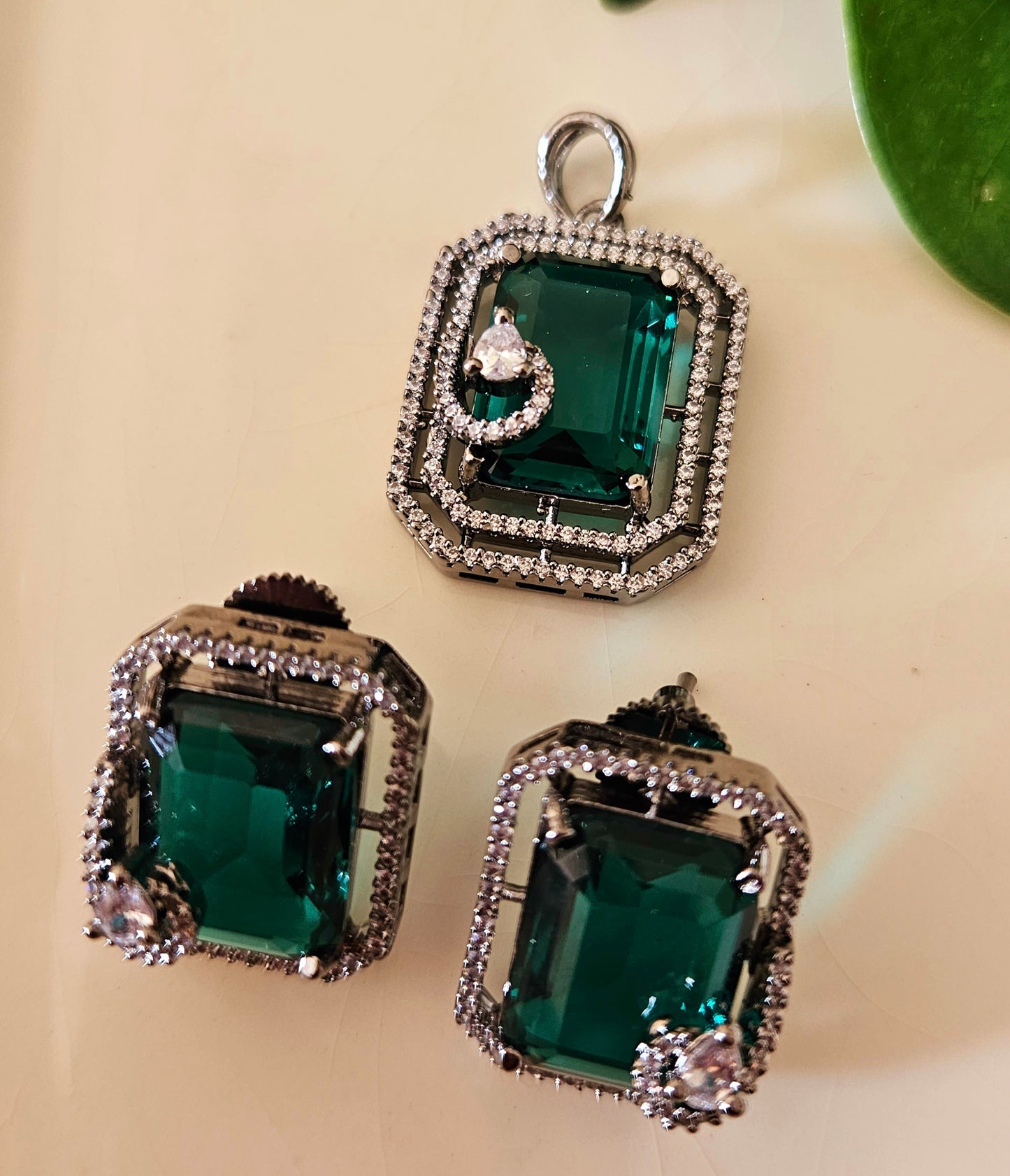 Platinum finish pendant set in topaz/green/moss green stone accentuated with CZ, matching studs (earrings)