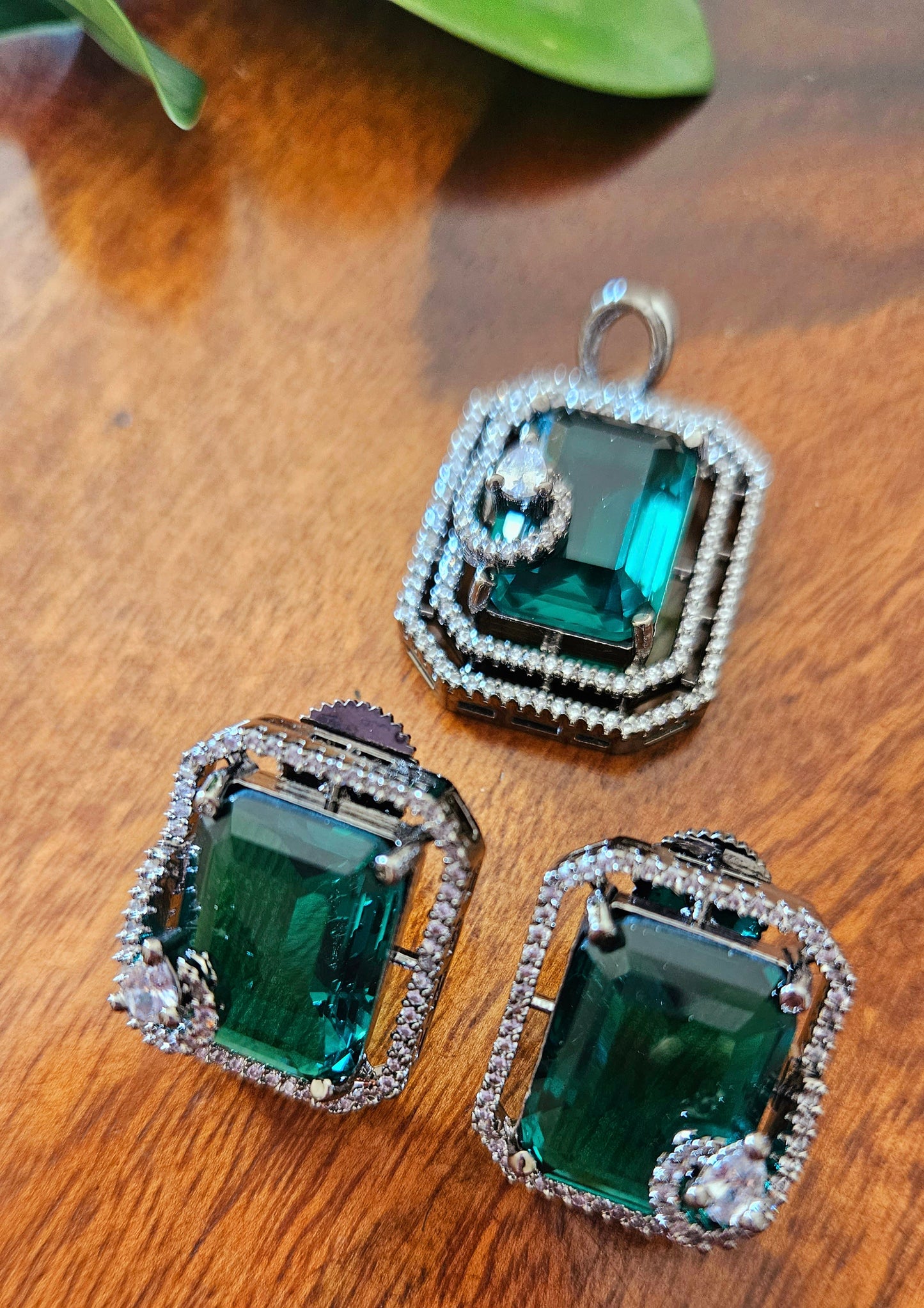 Platinum finish pendant set in topaz/green/moss green stone accentuated with CZ, matching studs (earrings)