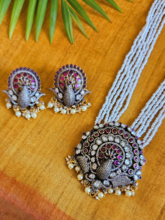 Antique finish pendant set, poth pearl necklace with peacock design pendant with red stone, kundan and CZ, matching earrings