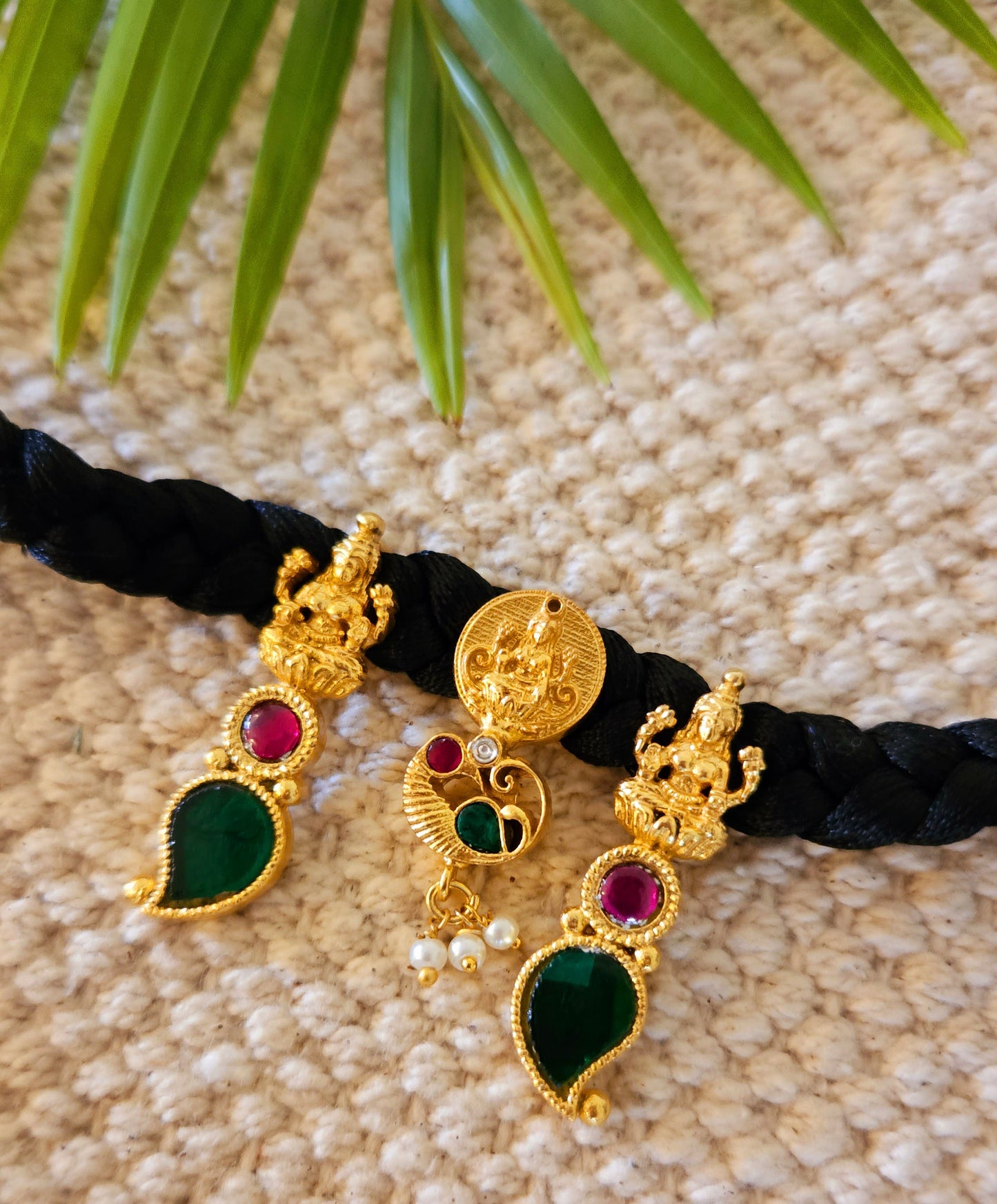 Choker (necklace) with three Lakshmi tikdas on black string