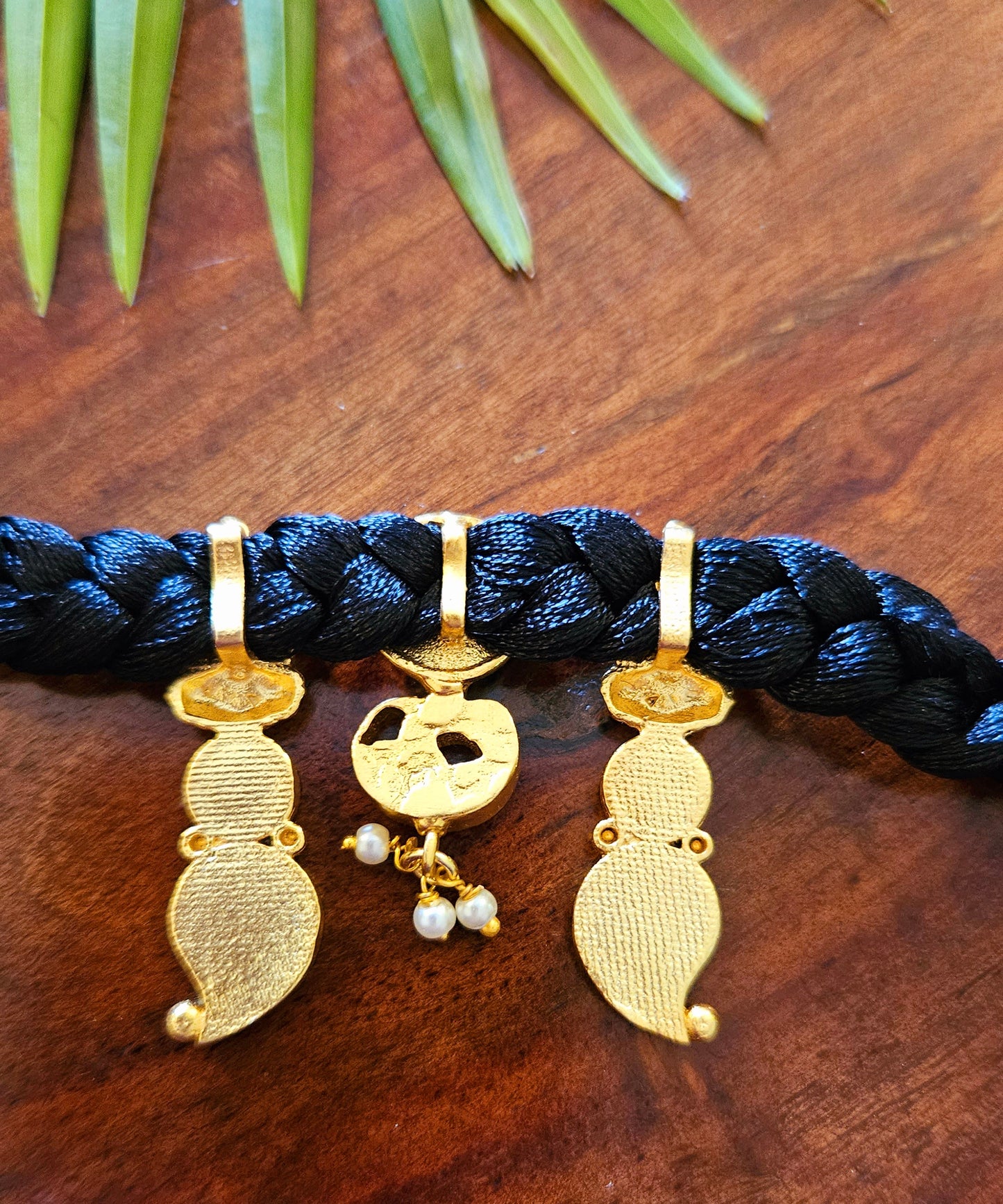 Choker (necklace) with three Lakshmi tikdas on black string