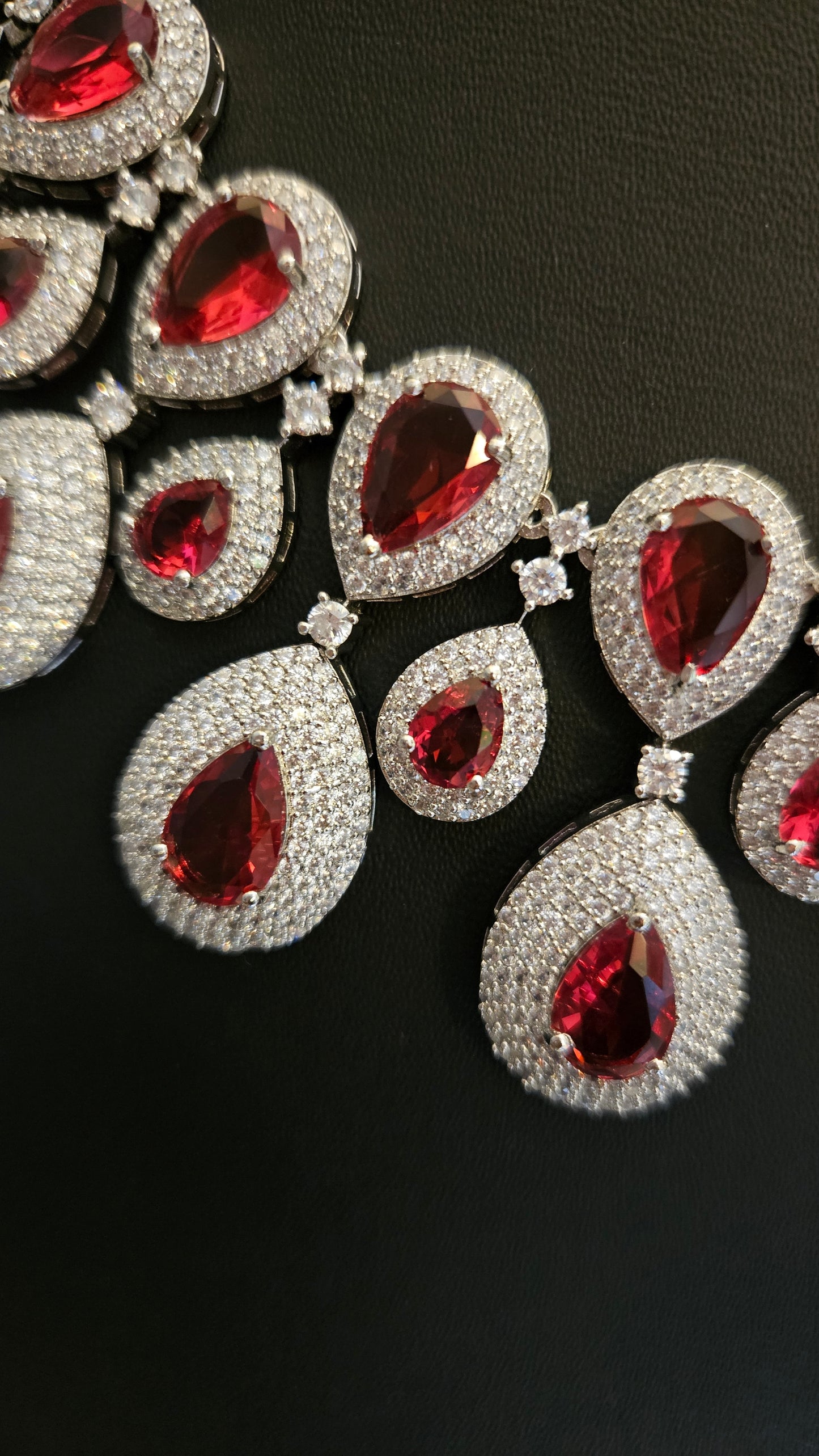 Platinum finish ruby set, teardrop themed multi-layered big necklace in ruby in CZ, matching earrings