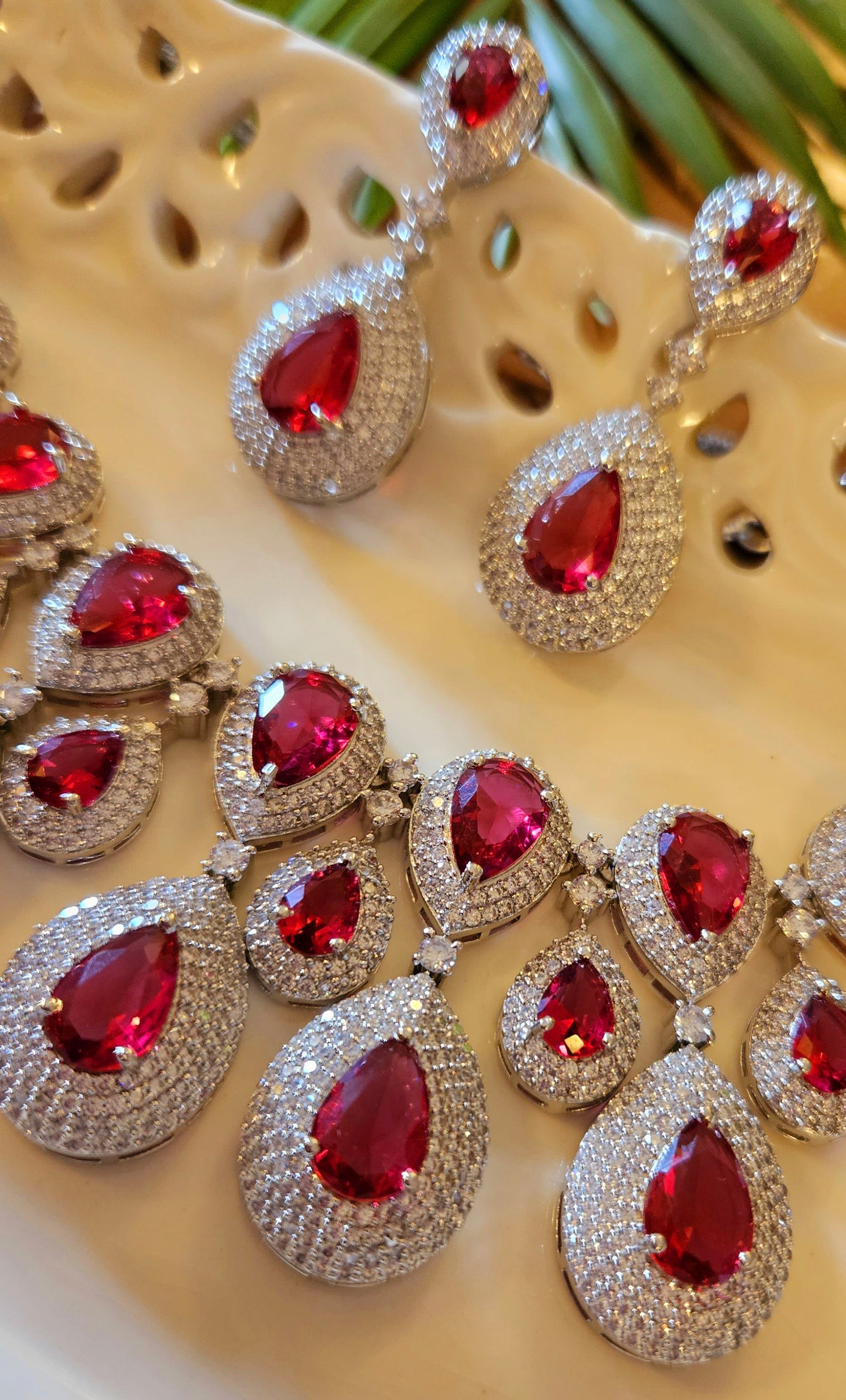 Platinum finish ruby set, teardrop themed multi-layered big necklace in ruby in CZ, matching earrings