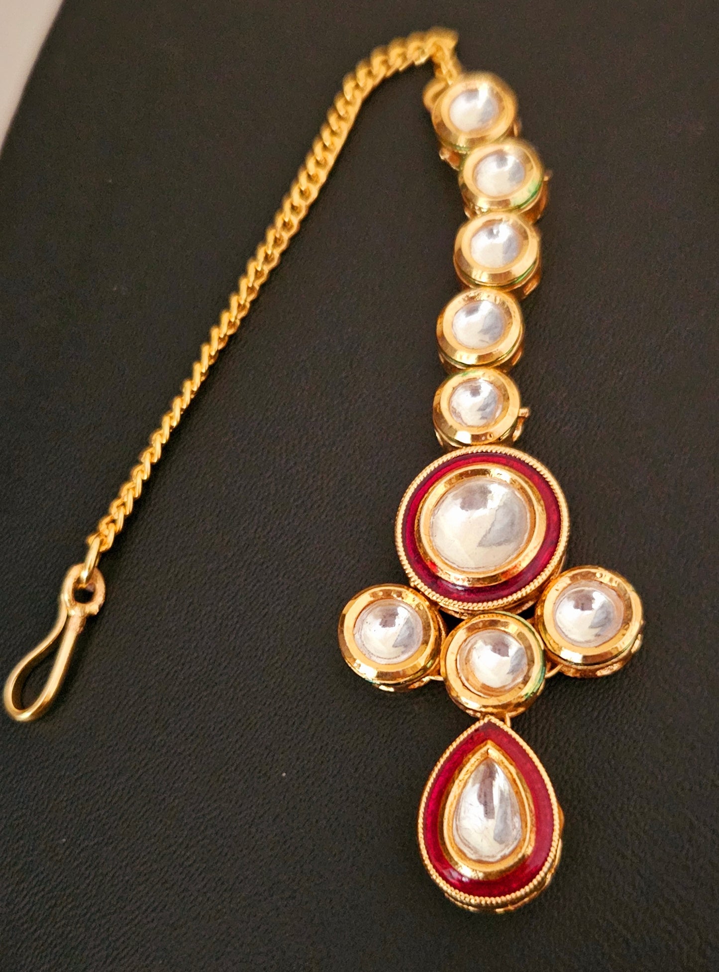 Gold finish kundan set, necklace with 2 layered kundan and red meenakari on pendant, matching maangtika and earrings