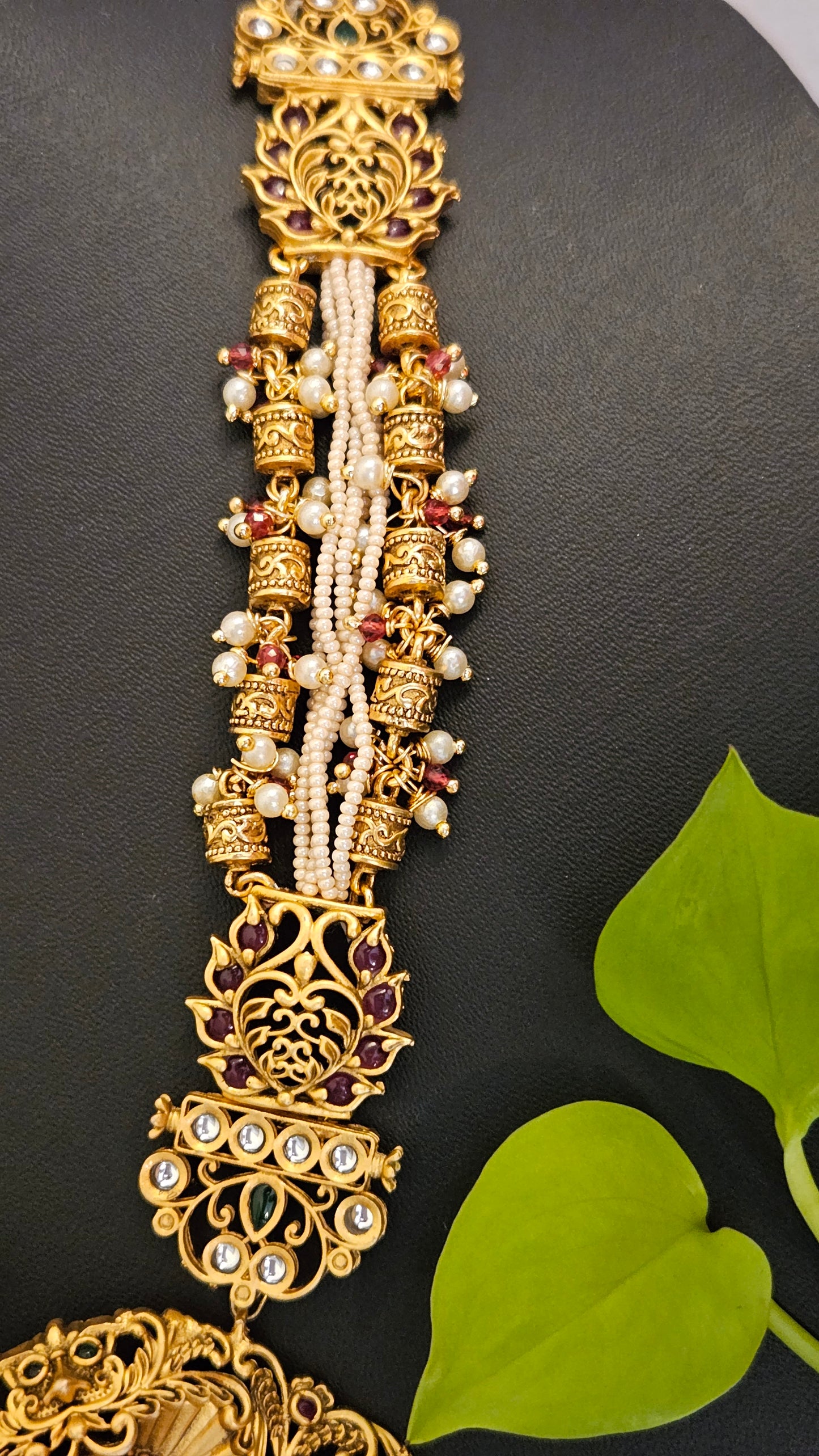 Temple jewelry set in matt gold finish necklace with krishna pendant with intricate carving, matching jhumka (earrings)